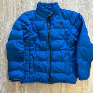 Boys blue North Face puffer jacket. Size 7/8. Good condition.